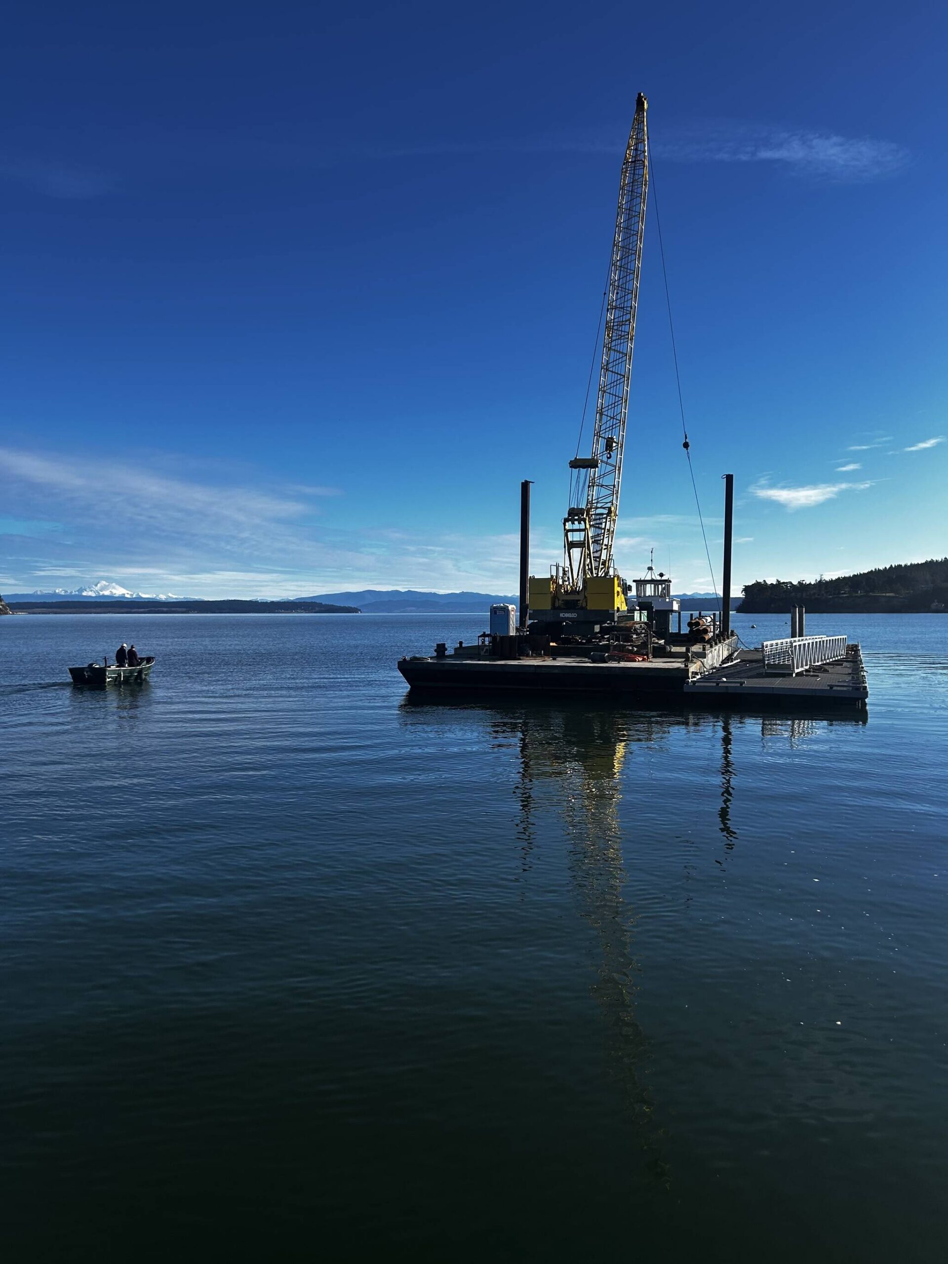 (Photo provided) The new dock was floated on a barge to the wharf, then installed with a crane.