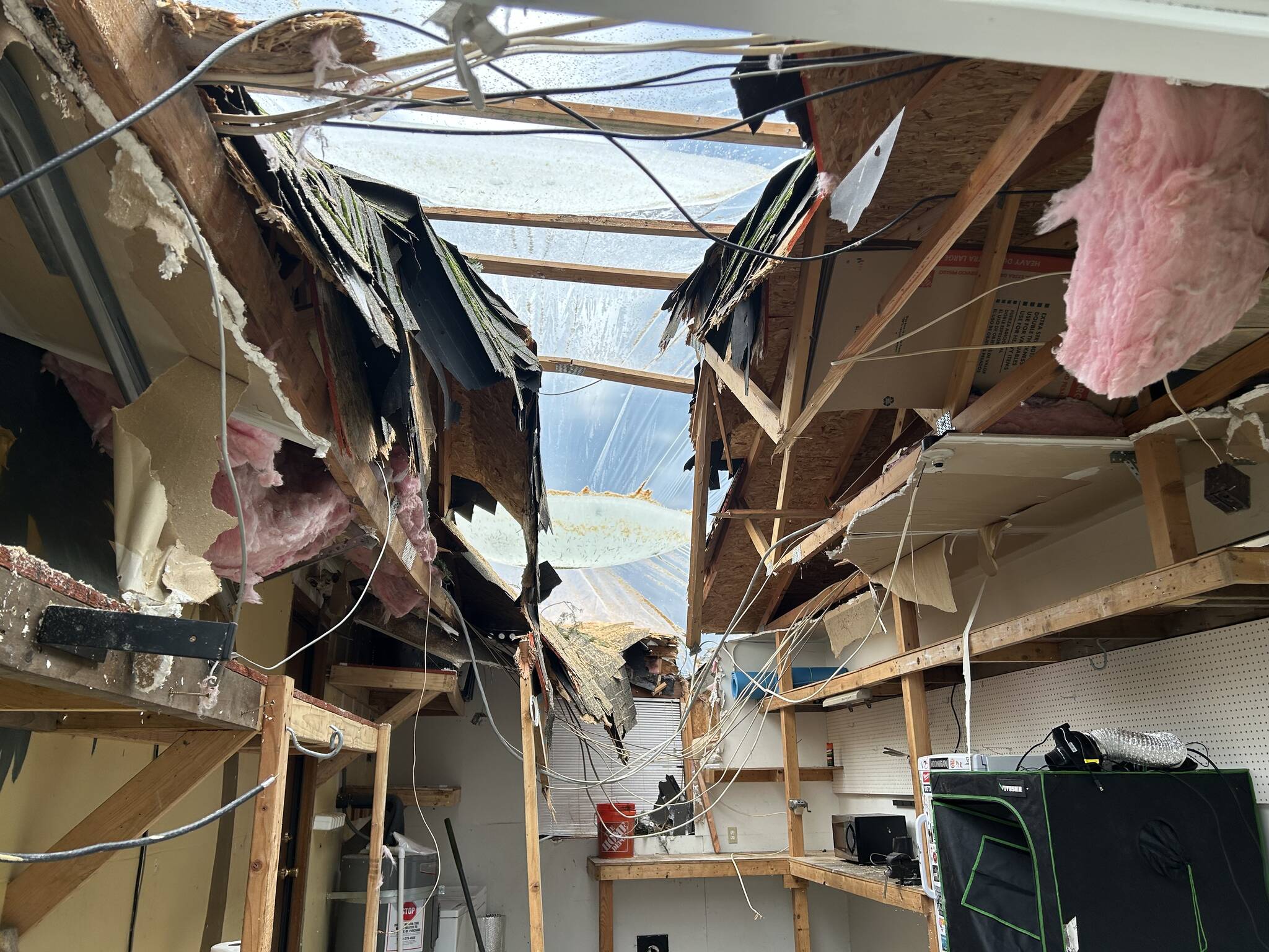 (Photo by Allyson Ballard) Obtaining approval to remove the rest of the tree which destroyed the Moncada familys garage, pictured here, and knocked out the homes electricity and hot water proved difficult.