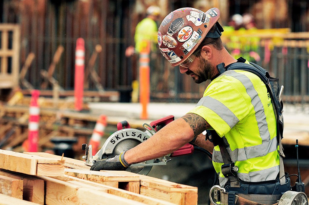 OAK HARBOR, Wash. - Jake Fletcher, a Hoffman Construction worker from Sedro Wooley cuts lumber for the new water treatment facility Sept. 20, 2016. Photo by Michael Watkins/Whidbey News Times.