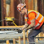 Photo by Michael Watkins/Whidbey News Times                                Ed Banik, a Hoffman Construction worker, places steel rebar for the new water treatment facility.