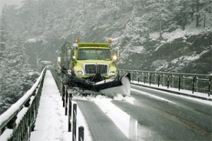 A Washington State Department of Transportation plow waits to cross onto Whidbey Island Monday. One lane of Deception Pass was blocked because of a car accident.