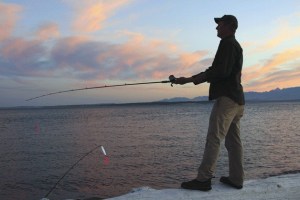 Chris Bolin of Oak Harbor isn’t satisfied with just one pink salmon that he caught Wednesday night at Keystone in Coupeville.