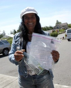 Mona Lisa Carney shows the messages and bottle she discovered on a beach near Fort Ebey State Park.