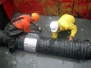 Workers patch a broken sewer outfall shortly after it burst this past May. Oak Harbor city staff have since decided to turn off the outfall permanently and shuttle the water to its lagoon facility on the Seaplane Base.