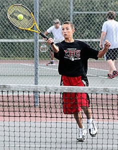 Joey Lippo returns a shot in his win in third doubles with William Nelson.