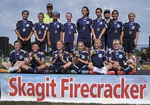 The North Whidbey GU-12 team shows off their medals after winning the silver division in the Skagit Firecracker Tournament. Bottom row from left to right