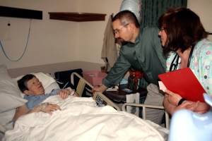 Oak Harbor resident Charlotte Jensen shares a room at Whidbey General Hospital as Dr. Mike Picco and nurse Dawn Sellgren examine her. A bond voters will decide on next month would pay for an expansion that includes single-patient rooms.