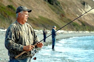 Rich Napierala fishes for coho salmon from the beach at Ebey’s Landing in Coupeville Thursday. He is visiting Whidbey Island from upstate New York.