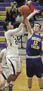 Dylan Harris drives by Ferndale's John Weg Saturday. Harris scored 24 points in the Wildcats loss.