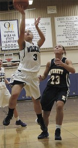 Jamie Estrella (3) gets by the defense of Everett's Tenika Wentworth (23) Wednesday.