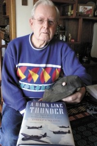 With a copy of “A Dawn Like Thunder” in the foreground