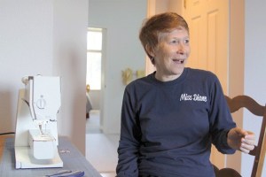 Ballet instructor Diane Geragotelis looks over fabric that she’ll use to make costumes for The Nutcracker