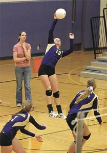 Roshel Muzzall blasts a back row kill for Oak Harbor.