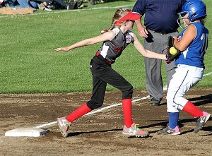 Central Whidbey's Savina Wells tags out a Sedro-Woolley runner at third base.
