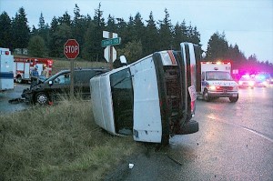 A Ford Bronco lays on its side after an accident on Highway 20 and North Jones Road Wednesday evening. Four people were sent to the hospital but were released later the same evening.