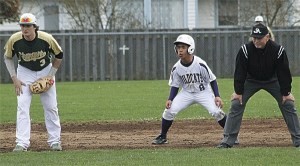 Oak Harbor's Casiano Atienza leads off second between Marysville-Getchell shortstop Brandon Bethers and umpire Jim Shulock.