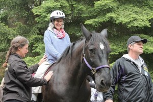 ​Swedish Medical Center patient Maria Peccorini is all smiles as she rides a horse. Peccorini has multiple sclerosis. ​  aslkjhdfa slkjhf aksfsa