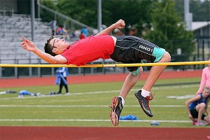 Corban Ferguson leaps to first place in the varsity high jump.