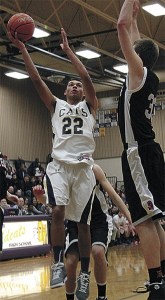 Oak Harbor's Dyllan Harris scores over Mountlake Terrace's 6-7 Greg Bowman.