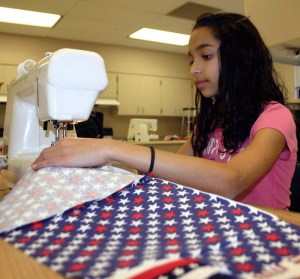 Seventh-grade student Chante Powell learned to sew to make quilts for the American Hero Quilts project.