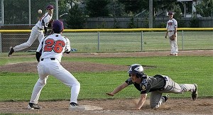 Whidbey pitcher Johnny Thurston throws to Steven Richards in an attempt to pick off Anacortes' Ryan Campbell.