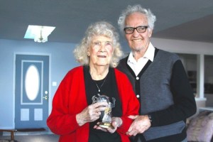 Martha Martin holds a perfume bottle that her husband Bill gave as his first gift to her during Christmas of 1939. The bottle was in the shape of a bride. The Martins live in Langley.