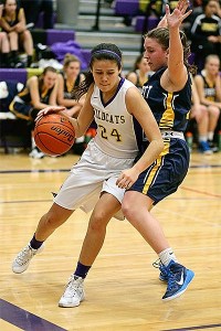 AnnaBelle Whitefoot tries to slip by a Everett defender in Friday's game.