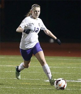 Alyssa Cross closes in on the ball in Oak Harbor's match with Shorewood on Thursday.
