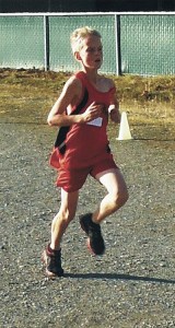 Ryan Vasileff heads to the finish line to win the middle school seventh-grade boys league cross country race.