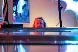 The Machine SHOP owner Tim Leonard peers over his collection of retro pinball machines in the recently opened Langley arcade. Leonard’s collection is comprised of the old models