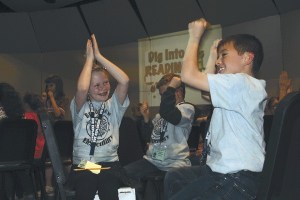 Students from Broad View Elementary School in Oak Harbor celebrate after learning they earned a perfect score in the second annual Island Reading Challenge at Oak Harbor High School on May 29. Third grader teams from all seven public elementary schools on Whidbey Island participated in the event that is aimed at improving reading skills.