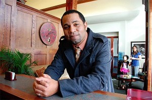 Gerry Oliver sits in his new real estate office