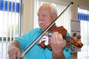 Above: Charles Terpenning practices part of the music he’ll be playing in Sunday’s “Curtains Up!” concert with the Saratoga Orchestra. Below: Charles and Rae Terpenning retired on Whidbey Island and they’re both active in the Saratoga Orchestra and with music in general.