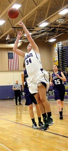 Montana Koslowski finishes a fast break for Oak Harbor.