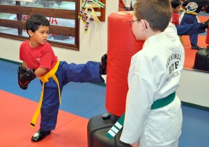 Kaya Lujan practices his kicks