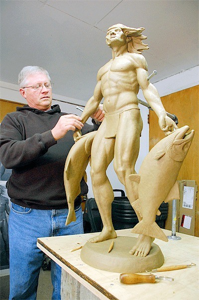 Oak Harbor artist Wayne Lewis puts some finishing touches on a bronze he is creating for downtown. Although he worked on the project for months he withdrew his proposal in the wake of tribal concerns.