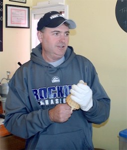New Kapaws owner Joel Norris readies a waffle cone as he opens up the shop. The Norris family purchased the popular ice cream shop from Paul and Karen Whelan.