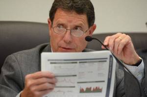 Oak Harbor City Councilman Bob Severns asks a question Tuesday about a plan to refinance the city’s 2004 water and sewer bonds. The council approved the measure