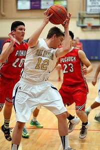 Christopher Viers pulls down a rebound for Oak Harbor Friday.