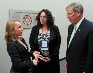 Eleven-year-old Emily Lang shares her K-Kids experiences with Sen. Johnny Isakson of Georgia as her mother