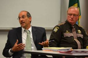 Island County Prosecutor Greg Banks answers a question during a meeting Monday night on a proposed law-and-justice levy. Sheriff Mark Brown is seated next to him.