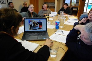 Members of the Oak Harbor Arts Commission looks at possible art proposals for SE Pioneer Way Tuesday evening. Replacing two earlier selected finalists