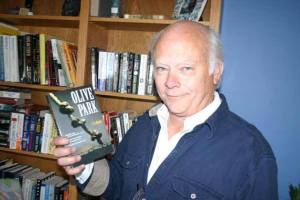 C.J. Booth holds his first novel