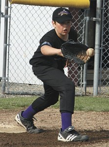 Jacob McMurdo receives a throw at first base in a recent NWLL 11/12 Major League all-star practice.