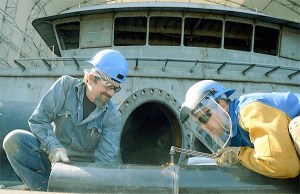 Tim Neraf assists Michael Christensen