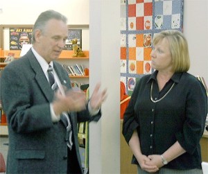 Island County Assessor Dave Mattens talks with Coupeville School District Business Manager Janet Fisher before Monday’s school board meeting.