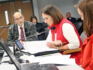 Island County Prosecutor Greg Banks discusses a budget request with county commissioners Helen Price Johnson and Jill Johnson.
