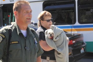 Carol Barnes of Whidbey Island Animal Control takes Skippy to her vehicle to take it to the veterinarian in Coupeville.