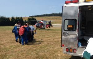 Central Whidbey Fire and Rescue emergency responders and a Whidbey General Hospital crew help transport Garrett Arnold to Harborview Medical Center in Seattle. He was injured in a fall.
