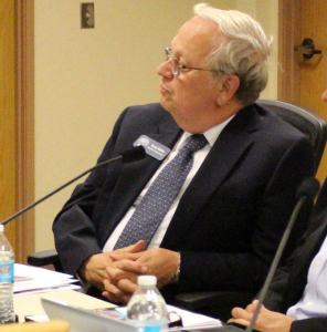 Gary Wallin announces his resignation from the Oak Harbor Schools Board of Directors at a Tuesday night meeting.